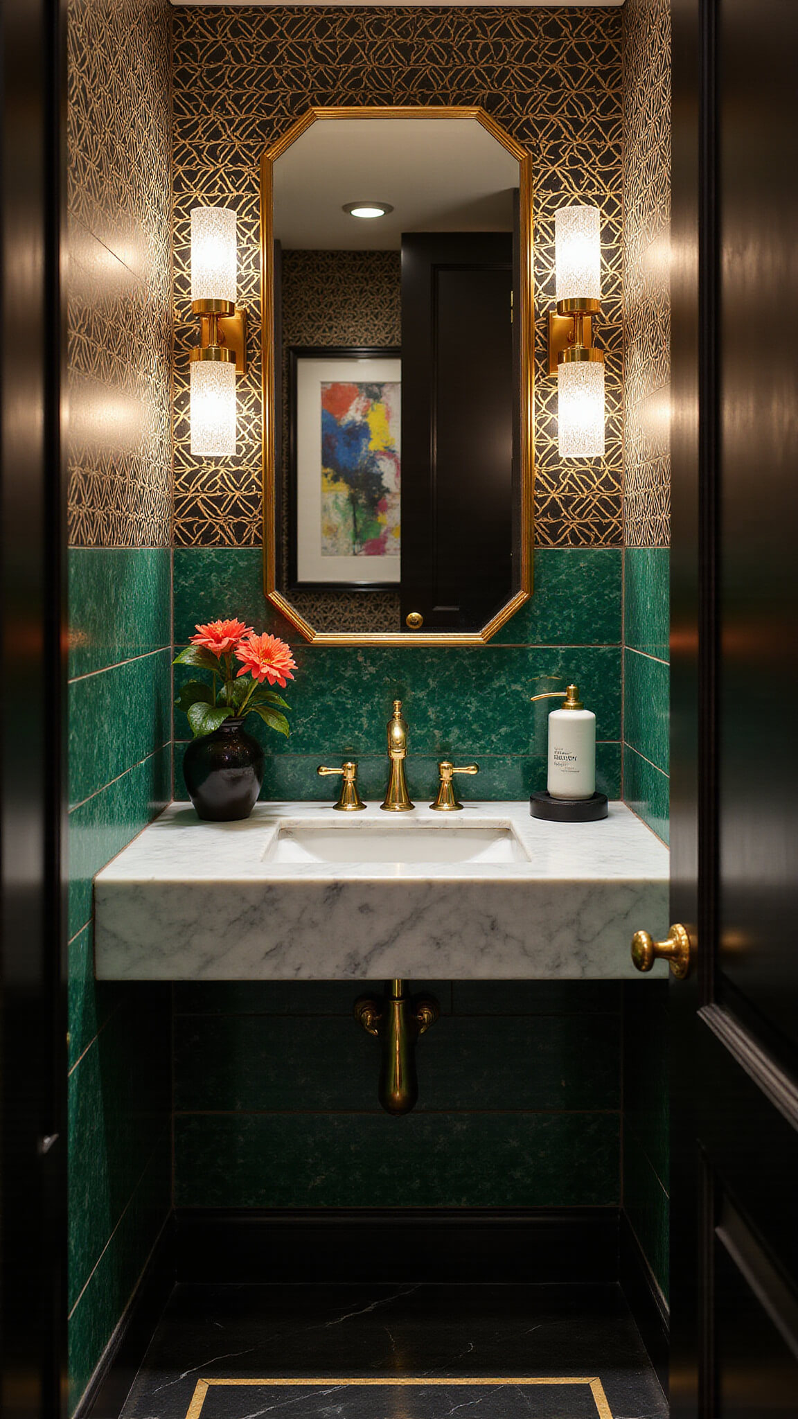 Art Deco powder room with emerald green tiles, black and gold wallpaper, marble vanity, and brass accents.