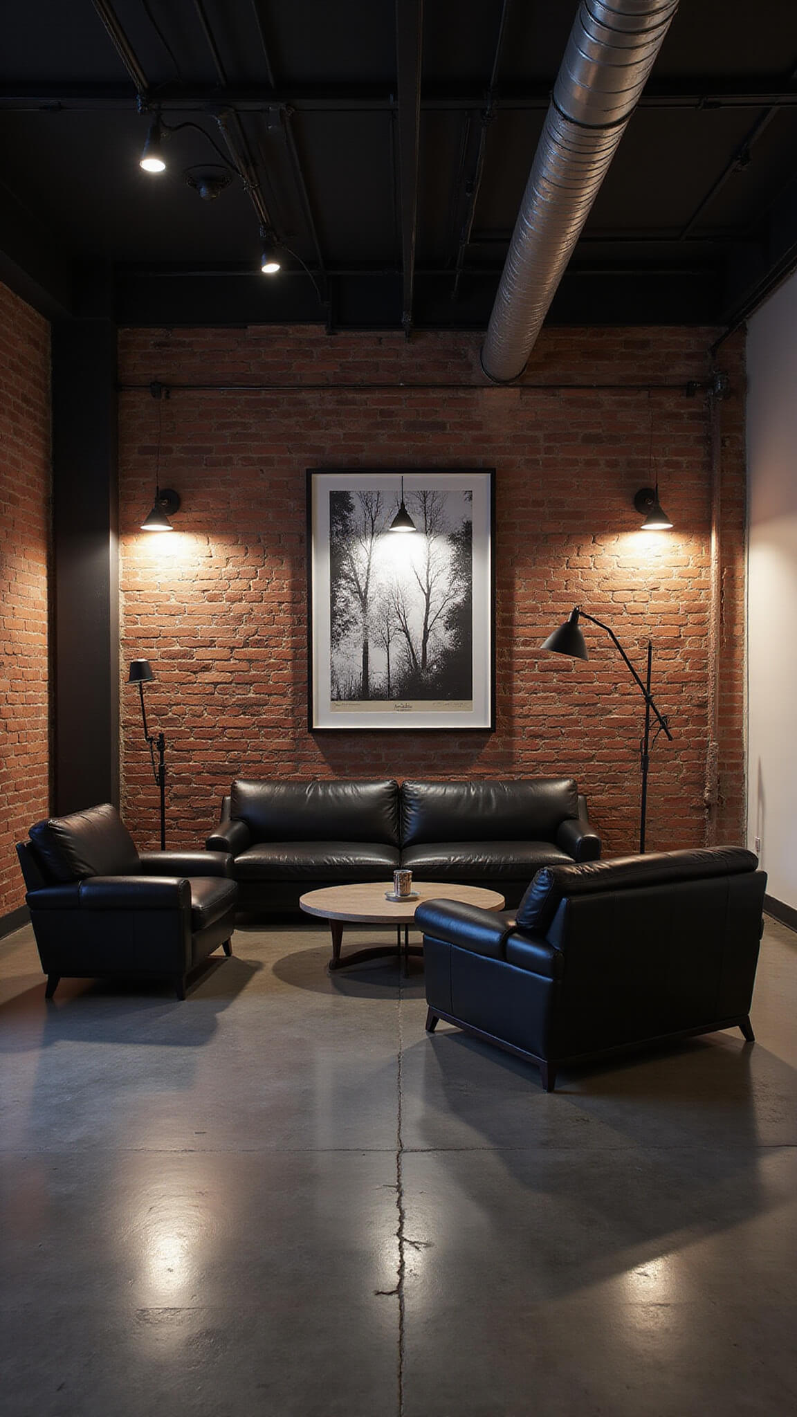 Industrial-chic loft living area at night with exposed brick, dramatic lighting, leather furniture, and contemporary art.